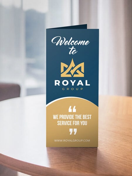 Tri-fold brochure displayed on a table with professional design and business branding