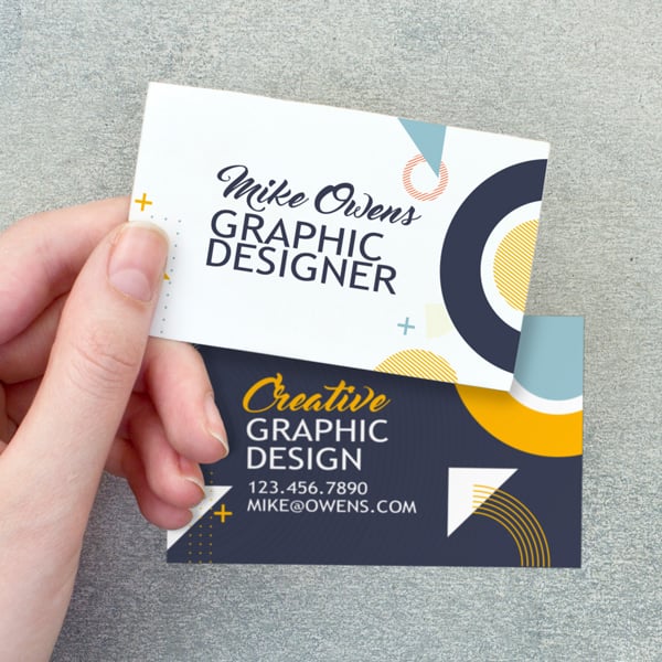 Double sided full color business card showing front and back design with modern graphics and contact information